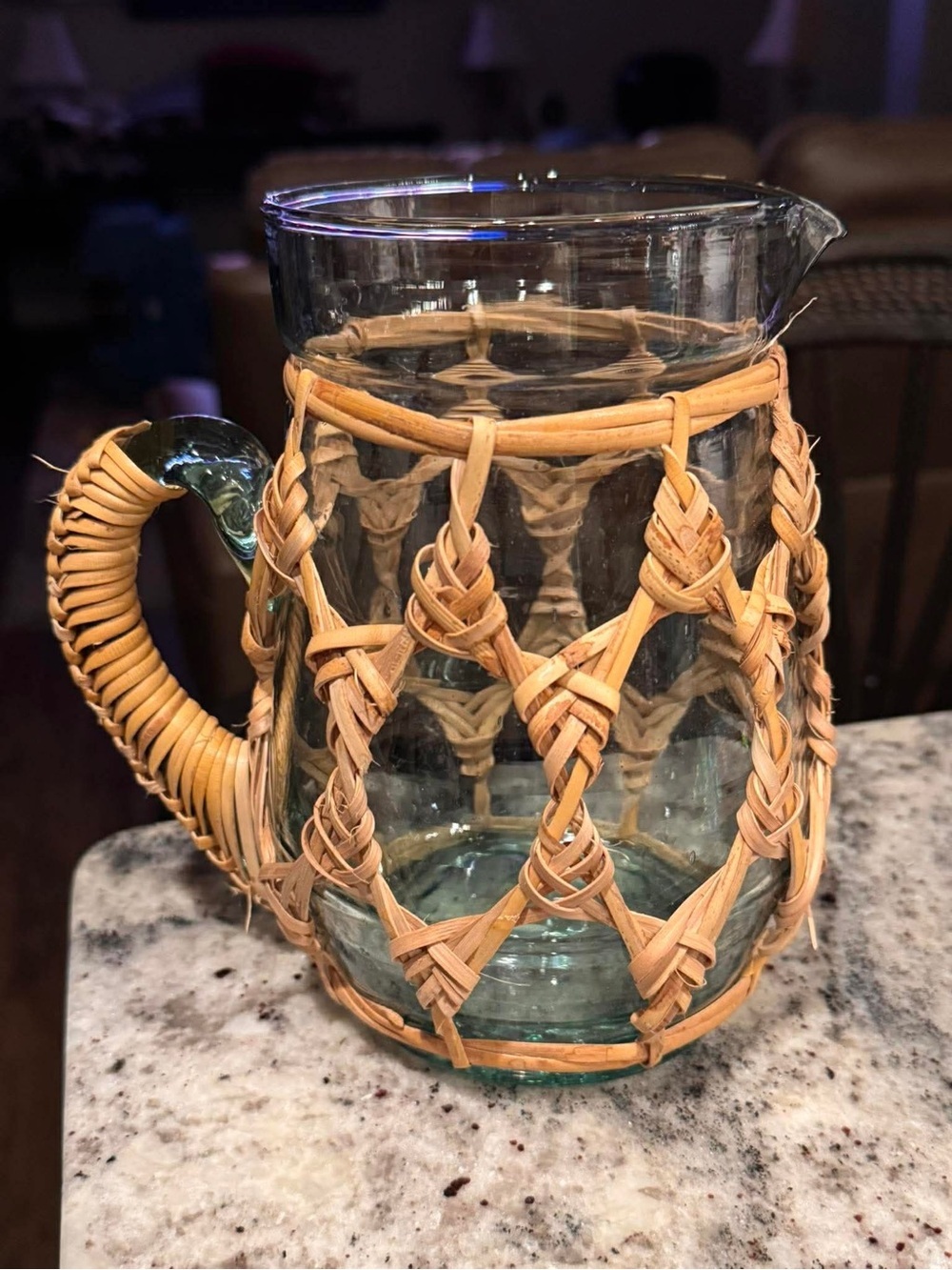 rattan-wrapped recycled glass pitcher
7 1/2” tall
4” wide top no chips or cracks